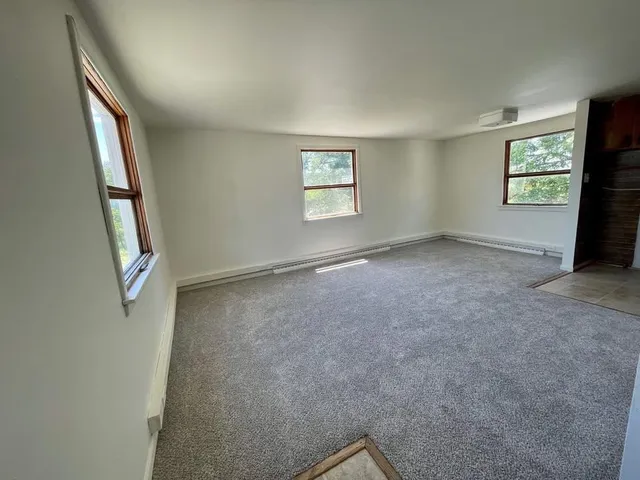 an empty room with windows