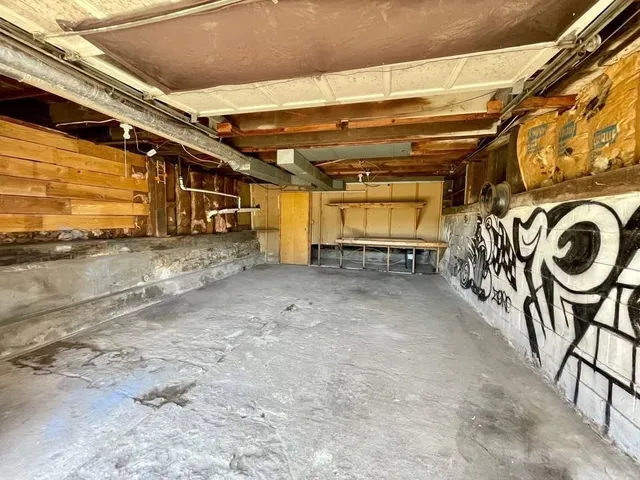 a view of a porch with a table and chairs