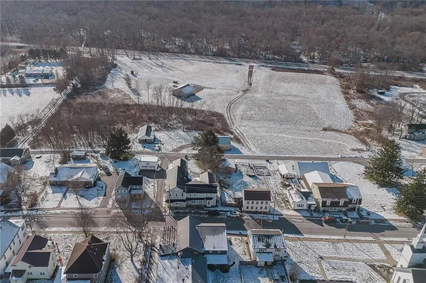 an aerial view of a house with outdoor space