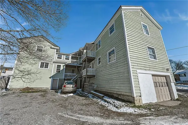 a view of a house with a backyard