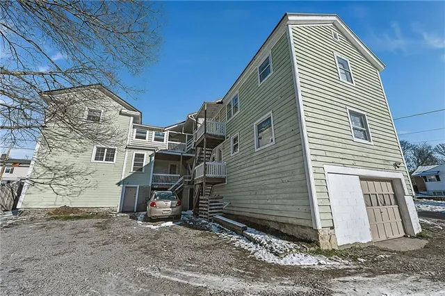 a view of a house with a backyard