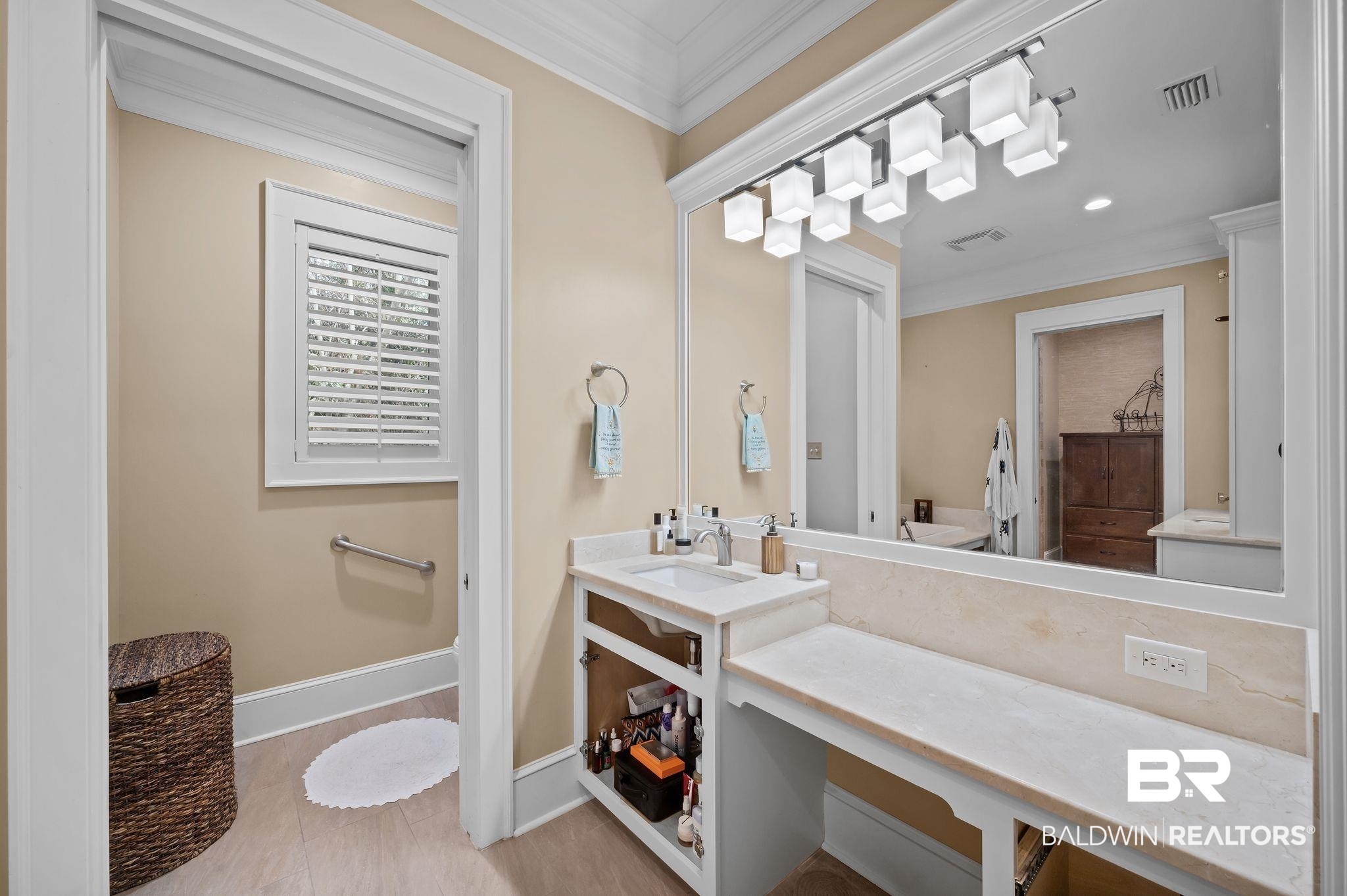 7850 Yorkhaven Road Mobile, AL 36695 - Photo 27 of 57 Bathroom with visible vents, vanity, baseboards, and ornamental molding