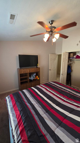 1330 North Dixie Downs Road, Unit 72 St. George, UT 84770 - Photo 18 of 21 Bedroom with a closet, ceiling fan, and dark colored carpet