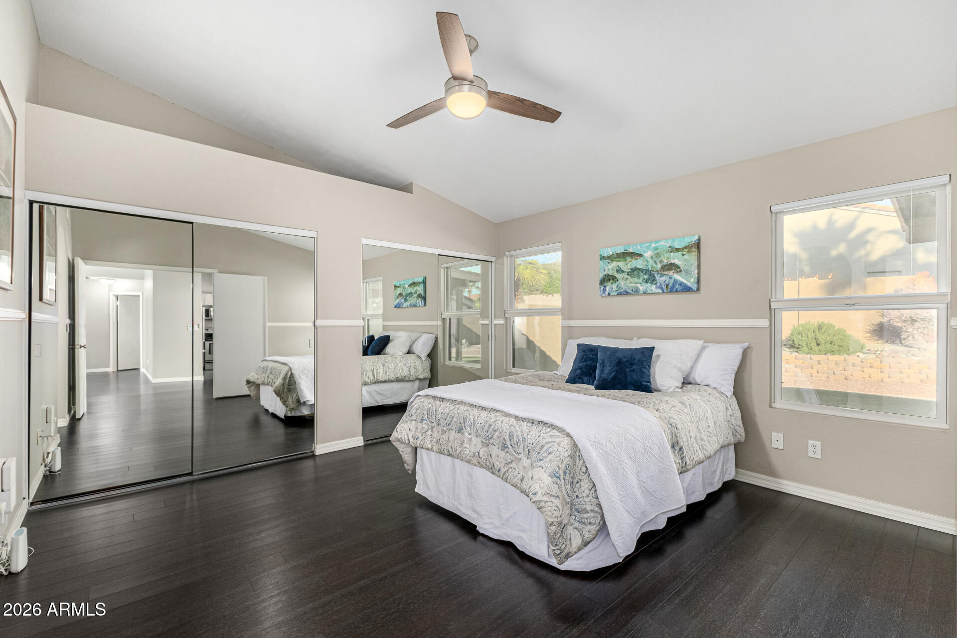 2710 East Rock Wren Road Phoenix, AZ 85048 - Photo 16 of 56 a spacious bedroom with a bed and a chandelier