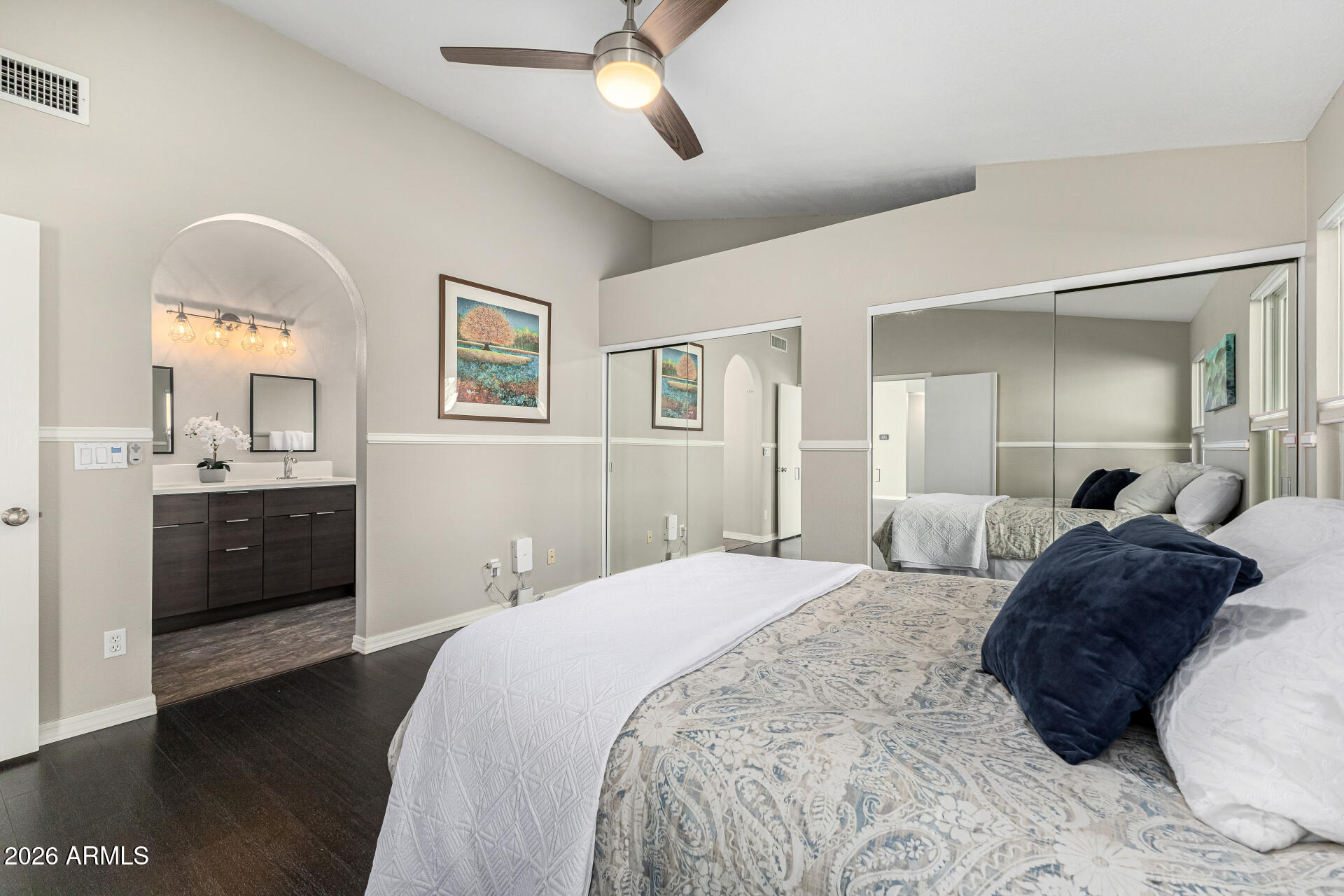 2710 East Rock Wren Road Phoenix, AZ 85048 - Photo 18 of 56 a bedroom with a bed and a chandelier