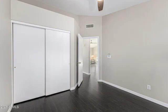 a view of livingroom with hardwood floor and a ceiling fan