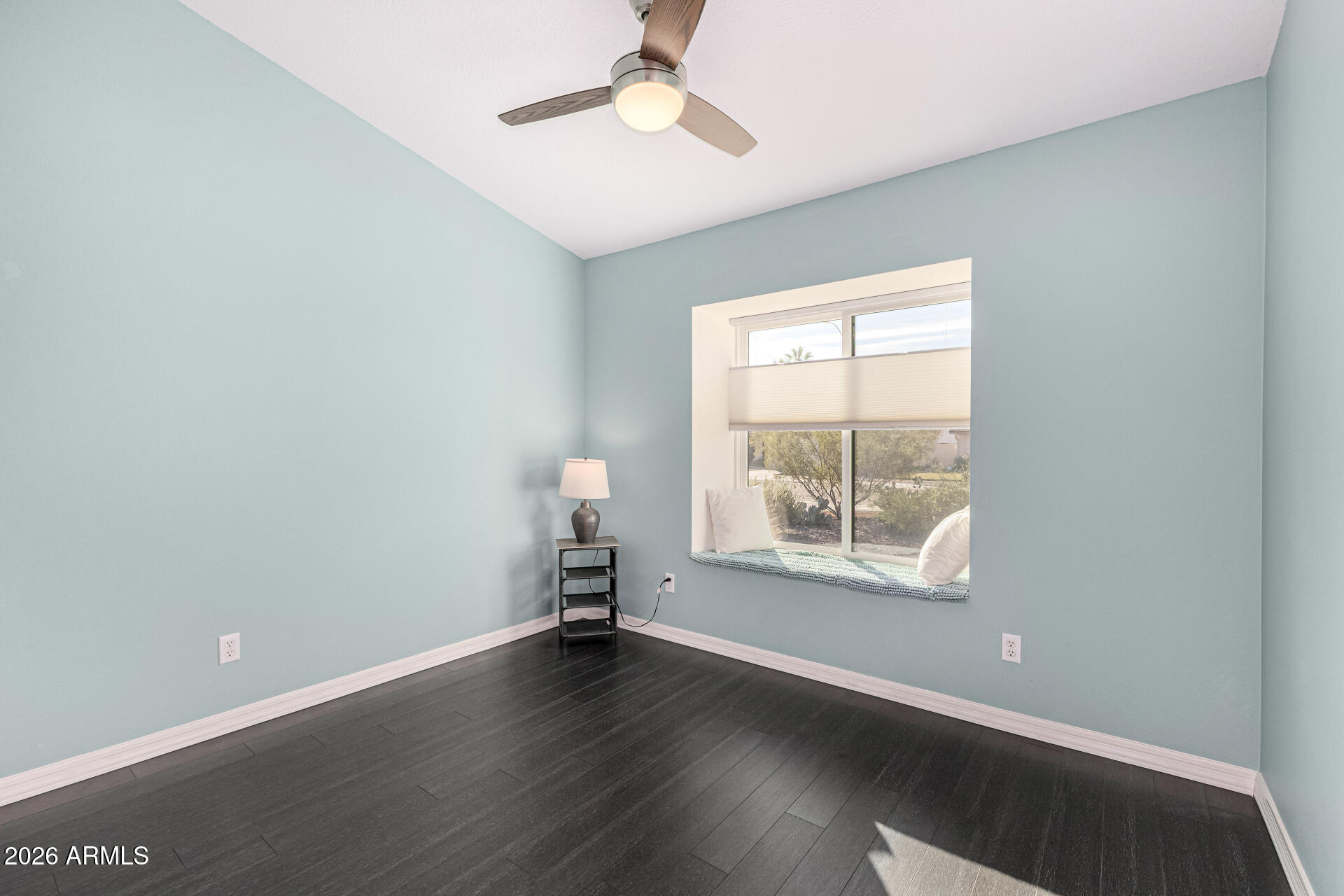 2710 East Rock Wren Road Phoenix, AZ 85048 - Photo 25 of 56 an empty room with wooden floor and windows