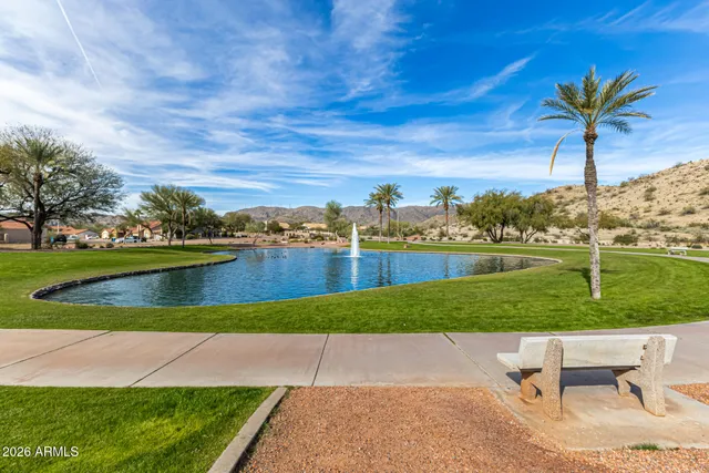 a view of a swimming pool and a yard