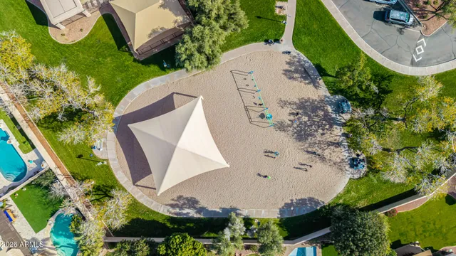 an aerial view of residential houses with outdoor space and river