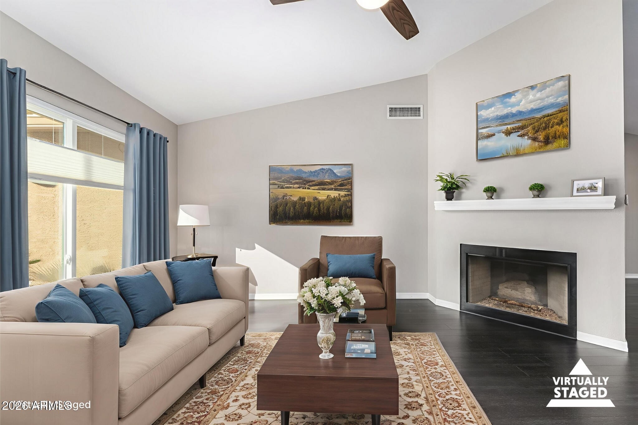 2710 East Rock Wren Road Phoenix, AZ 85048 - Photo 4 of 56 a living room with furniture and a fireplace