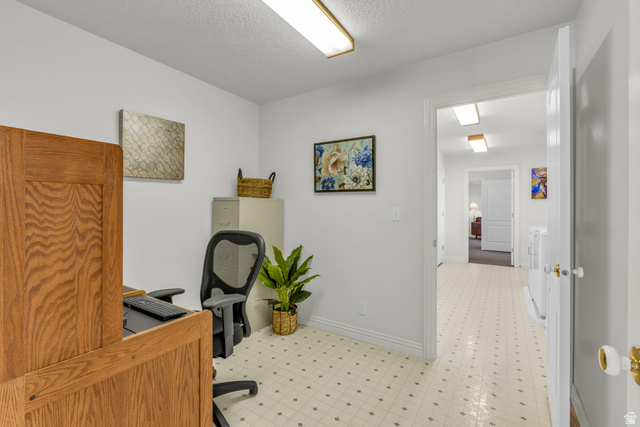 1060 West 2620th Street South Mapleton, UT 84664 - Photo 39 of 87 Home office featuring light flooring and a textured ceiling