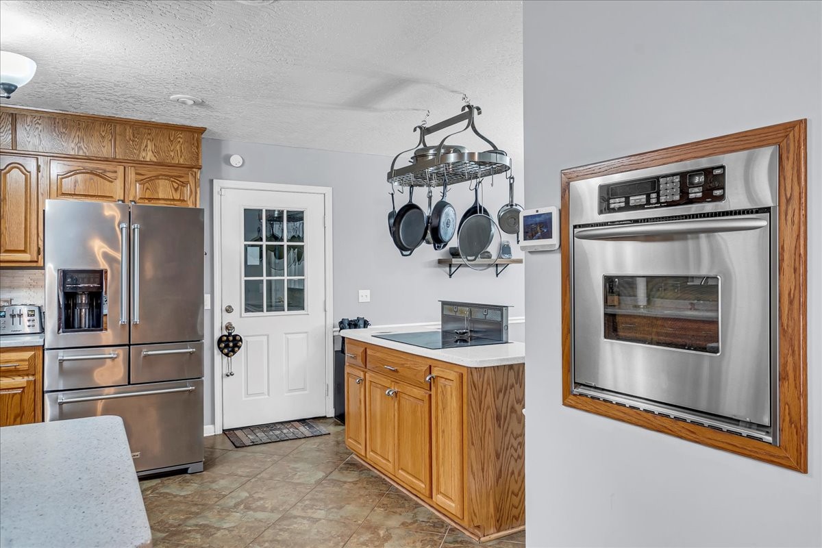 3955 River Road Baxter, TN 38544 - Photo 12 of 78 a kitchen with stainless steel appliances granite countertop a refrigerator and a stove top oven