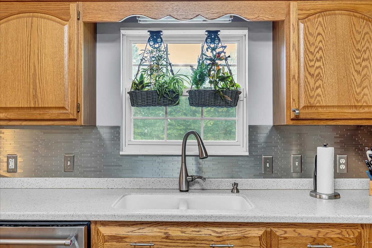 3955 River Road Baxter, TN 38544 - Photo 14 of 78 a kitchen with stainless steel appliances granite countertop a sink and a window