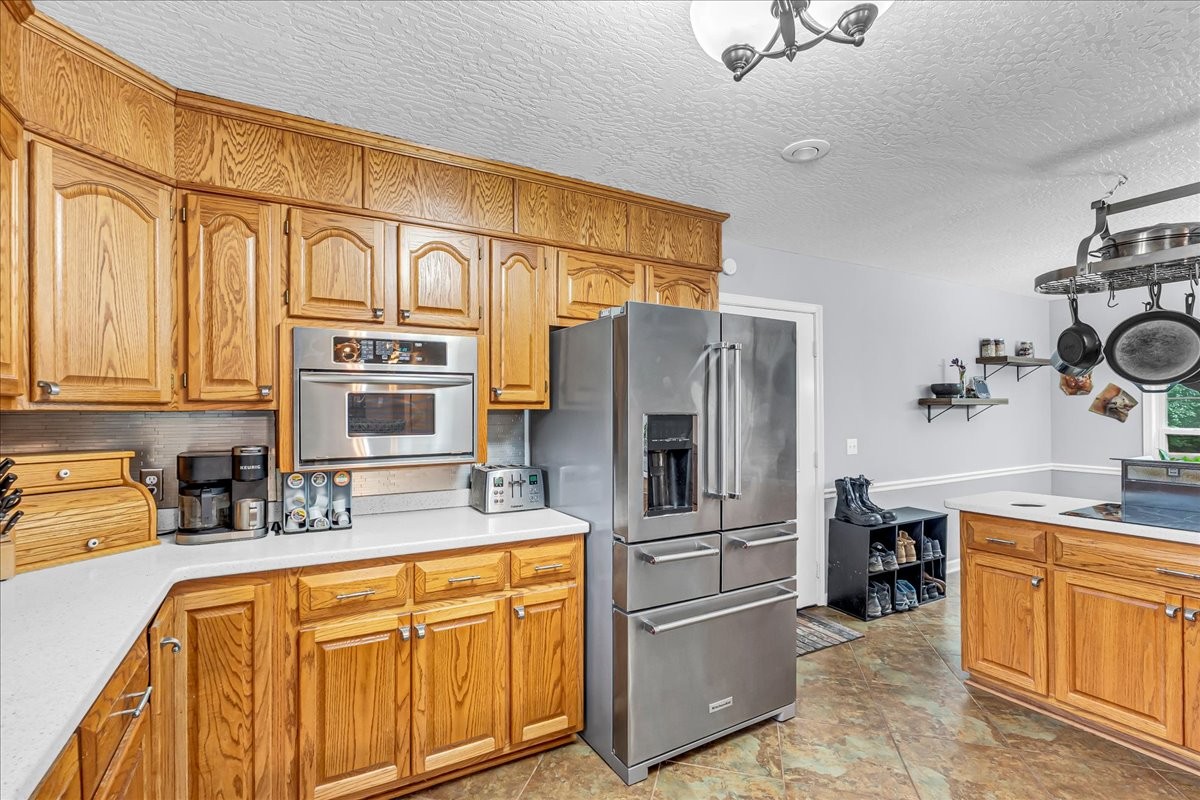 3955 River Road Baxter, TN 38544 - Photo 16 of 78 a kitchen with stainless steel appliances granite countertop a refrigerator and a sink