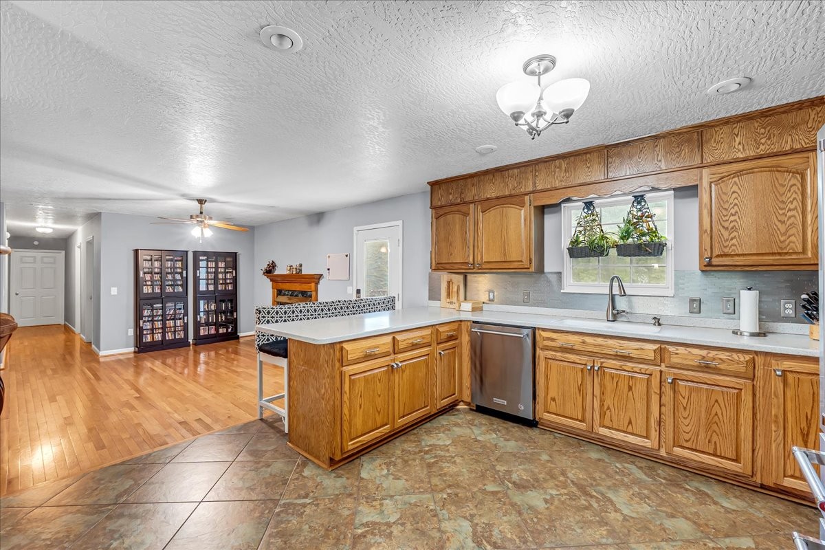 3955 River Road Baxter, TN 38544 - Photo 18 of 78 a kitchen with stainless steel appliances granite countertop a sink and cabinets