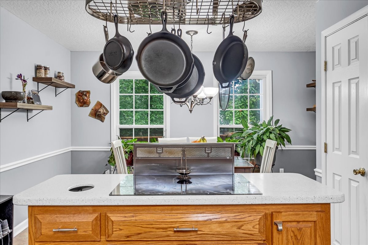 3955 River Road Baxter, TN 38544 - Photo 20 of 78 a kitchen with kitchen island granite countertop a sink a stove and a wooden cabinets