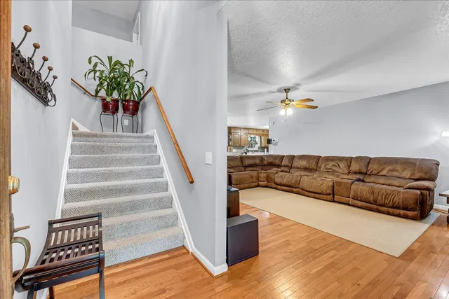 a living room with furniture and a chandelier