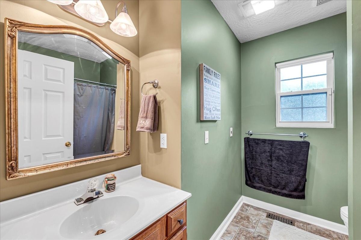 3955 River Road Baxter, TN 38544 - Photo 24 of 78 a bathroom with a sink and a mirror