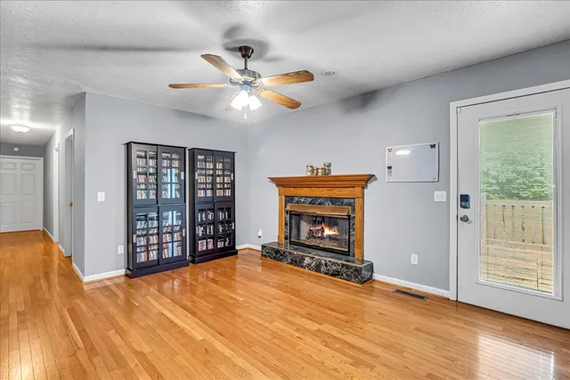 a kitchen with stainless steel appliances granite countertop a sink a stove and refrigerator