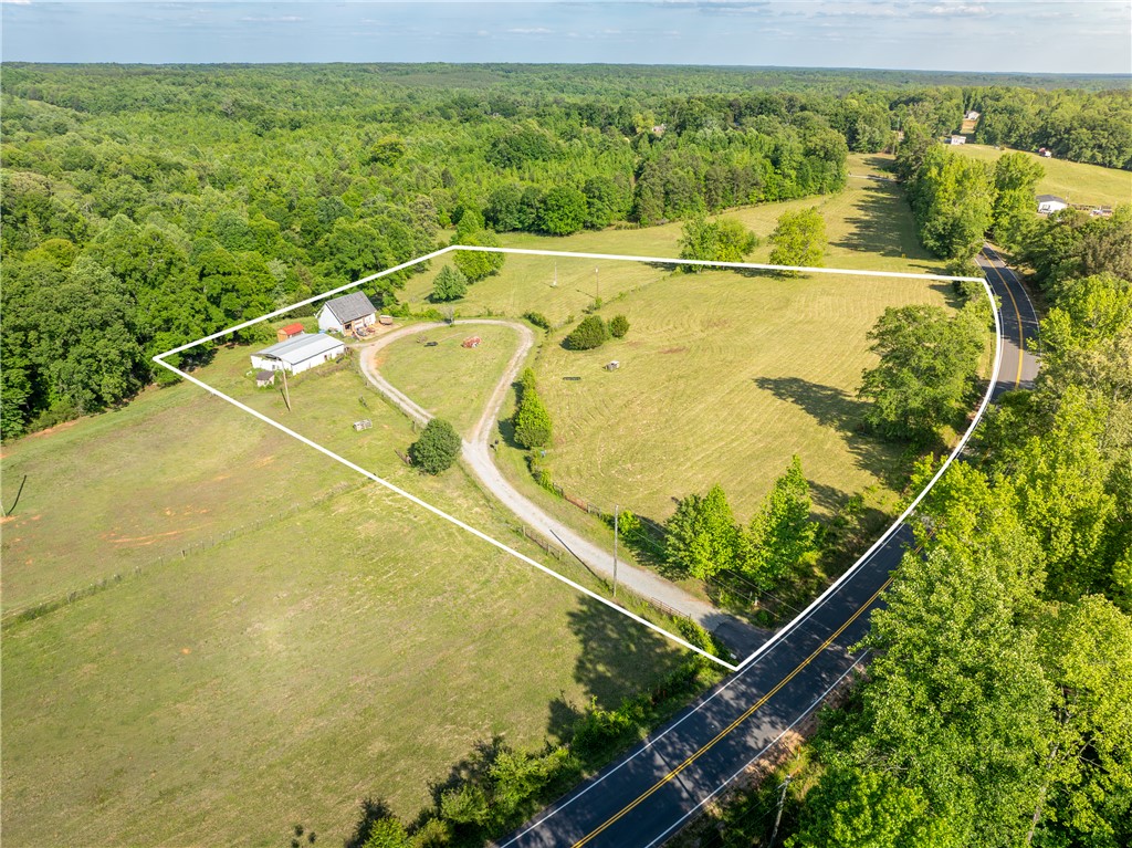 Expansive acreage provides ample space for privacy and potential development.