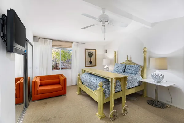 a bed room with a bed and a couch