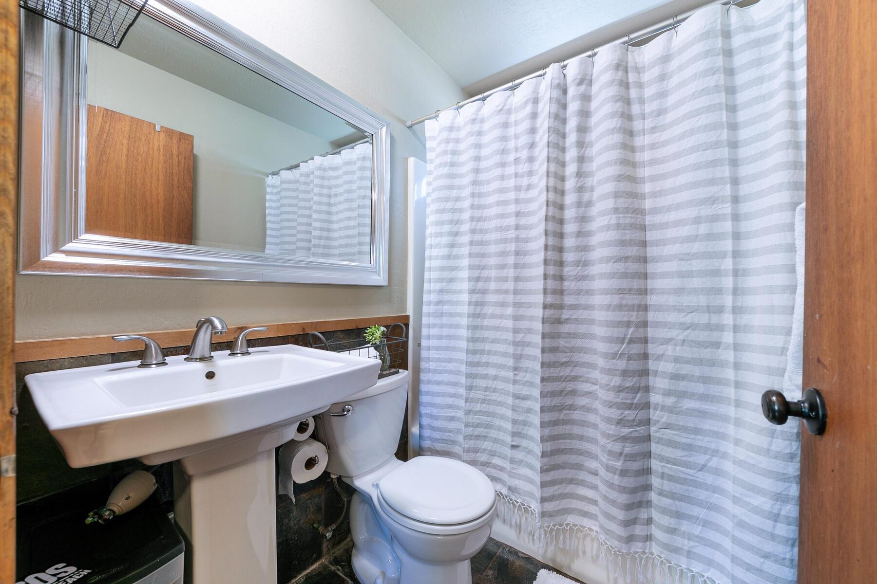 10243 Laburnham Circle Truckee, CA 96161 - Photo 12 of 21 a bathroom with a sink a toilet and mirror
