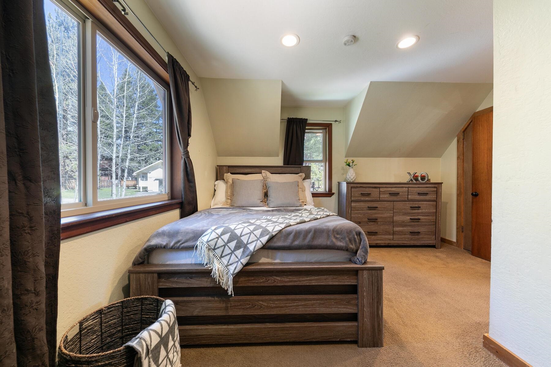 10243 Laburnham Circle Truckee, CA 96161 - Photo 13 of 21 a bedroom with a bed and a window