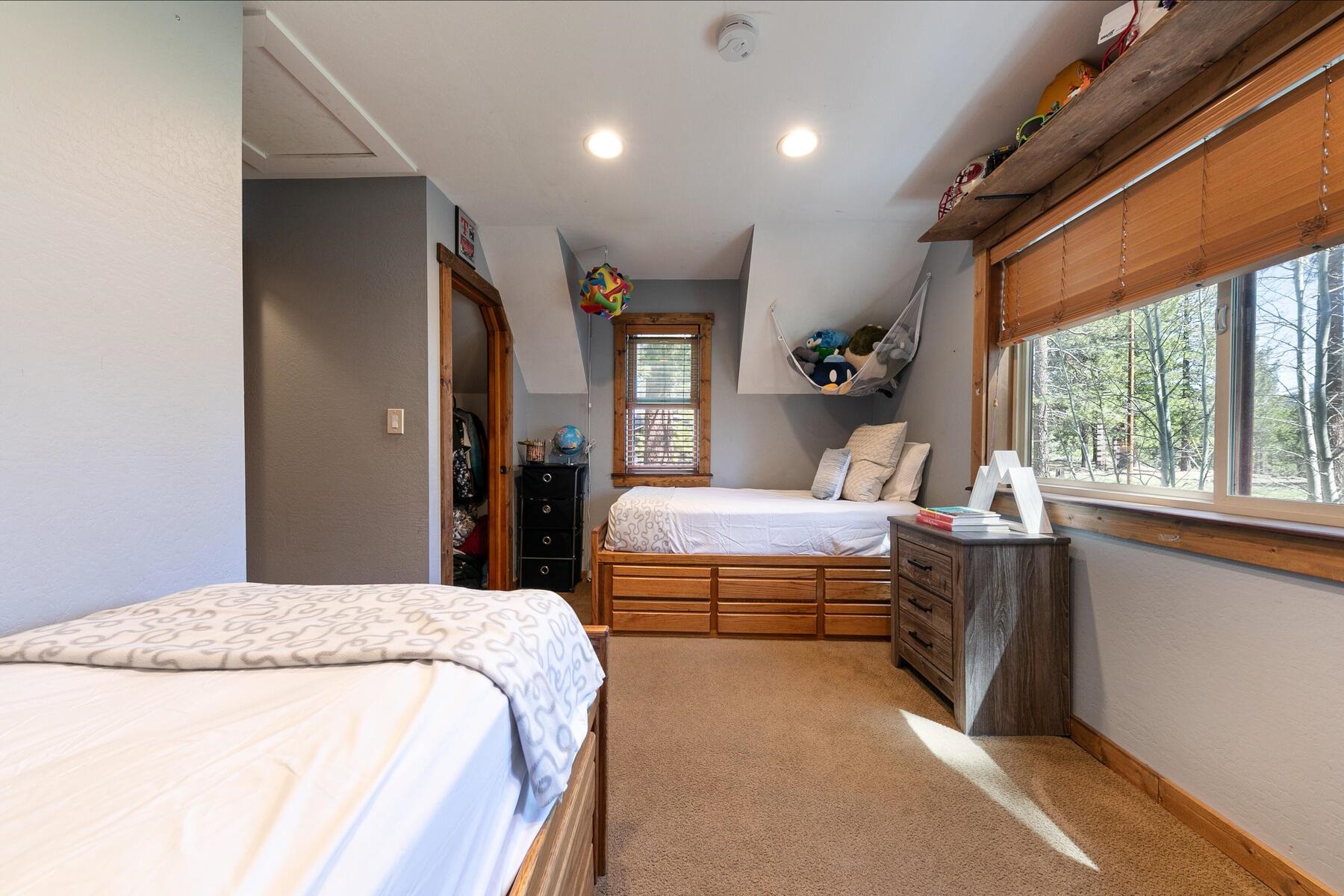 10243 Laburnham Circle Truckee, CA 96161 - Photo 16 of 21 a bedroom with a large bed and a large window