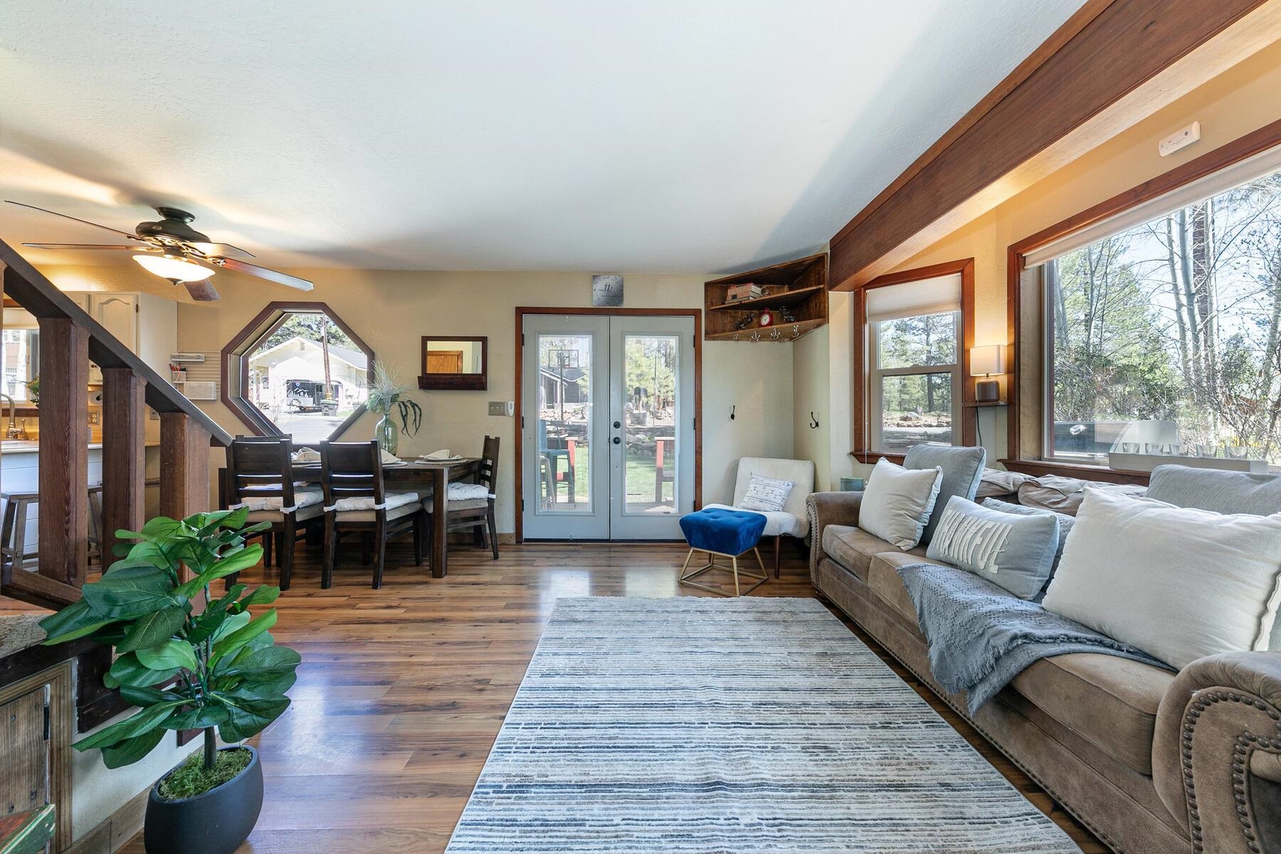10243 Laburnham Circle Truckee, CA 96161 - Photo 4 of 21 a living room with furniture a large window and wooden floor