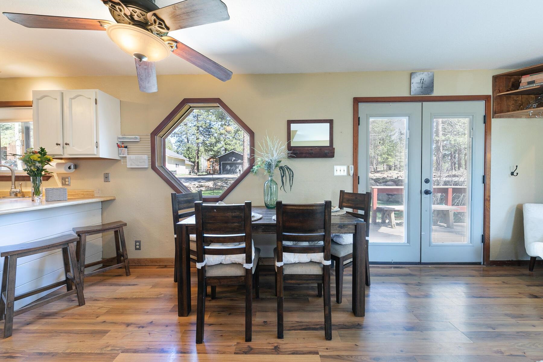 10243 Laburnham Circle Truckee, CA 96161 - Photo 6 of 21 a view of a dining room with furniture window and wooden floor