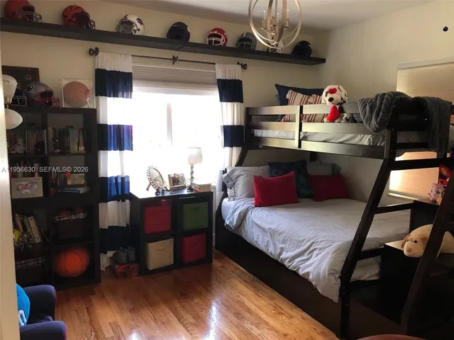 a bedroom with bed and a window