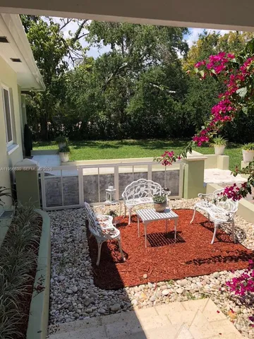 a front view of a house with yard