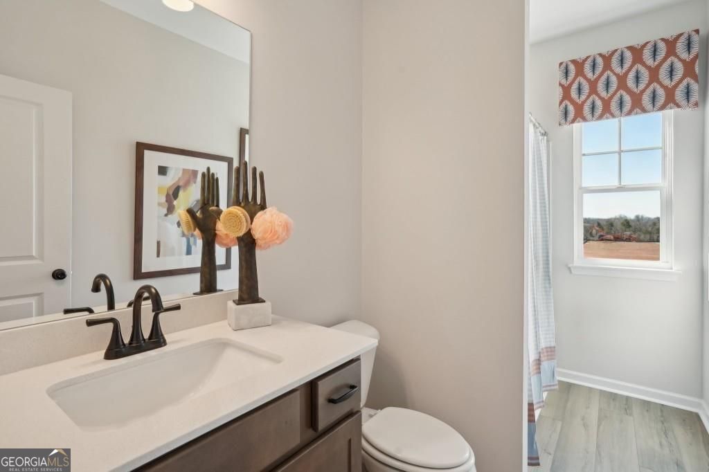 11 North Haven Drive Rome, GA 30165 - Photo 21 of 35 a bathroom with a sink vanity and toilet