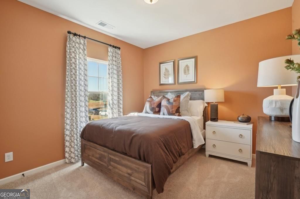 11 North Haven Drive Rome, GA 30165 - Photo 23 of 35 a bedroom with a bed and a night stand