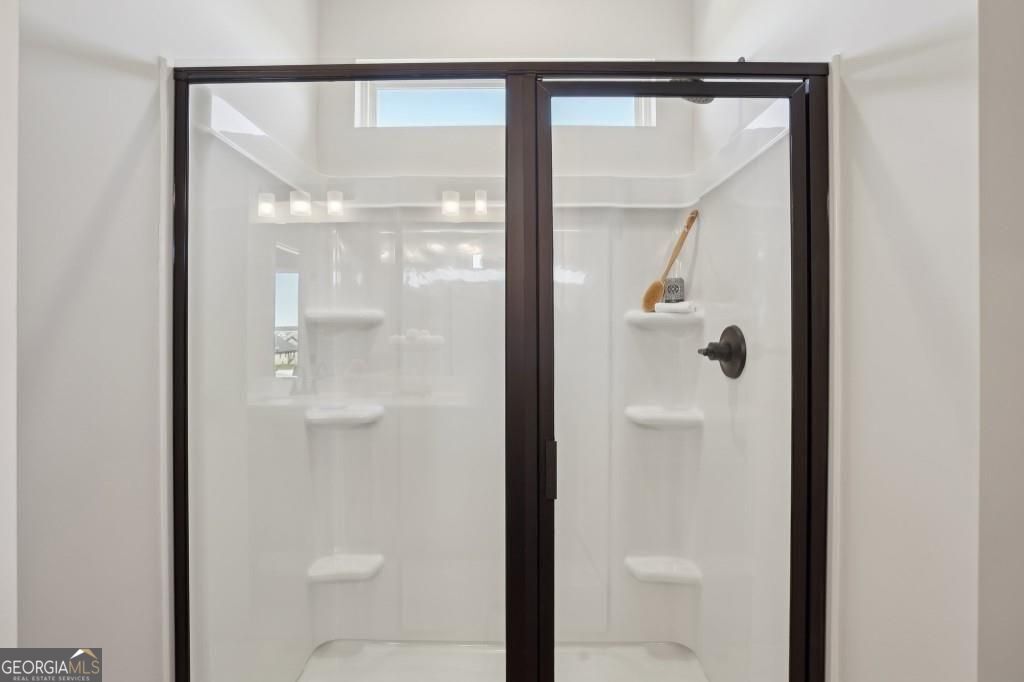 11 North Haven Drive Rome, GA 30165 - Photo 26 of 35 a bathroom with a glass shower door