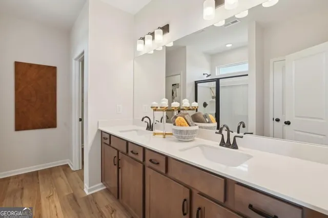 a bathroom with a sink a mirror and vanity