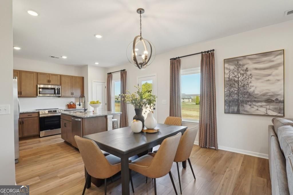 11 North Haven Drive Rome, GA 30165 - Photo 10 of 35 a view of a dining room with furniture window and wooden floor