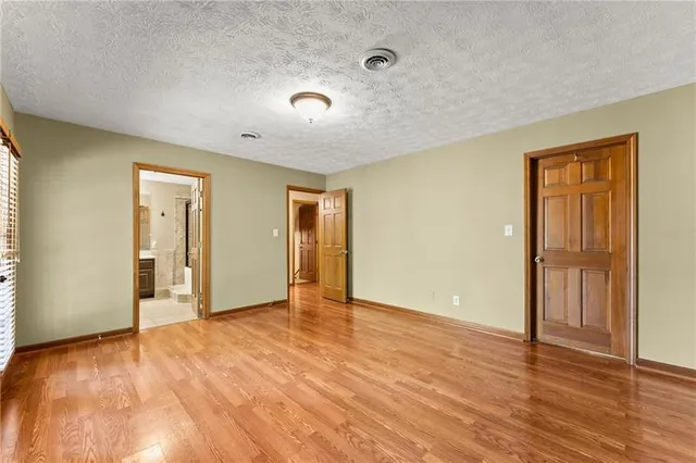 a bathroom with a sink mirror and a shower