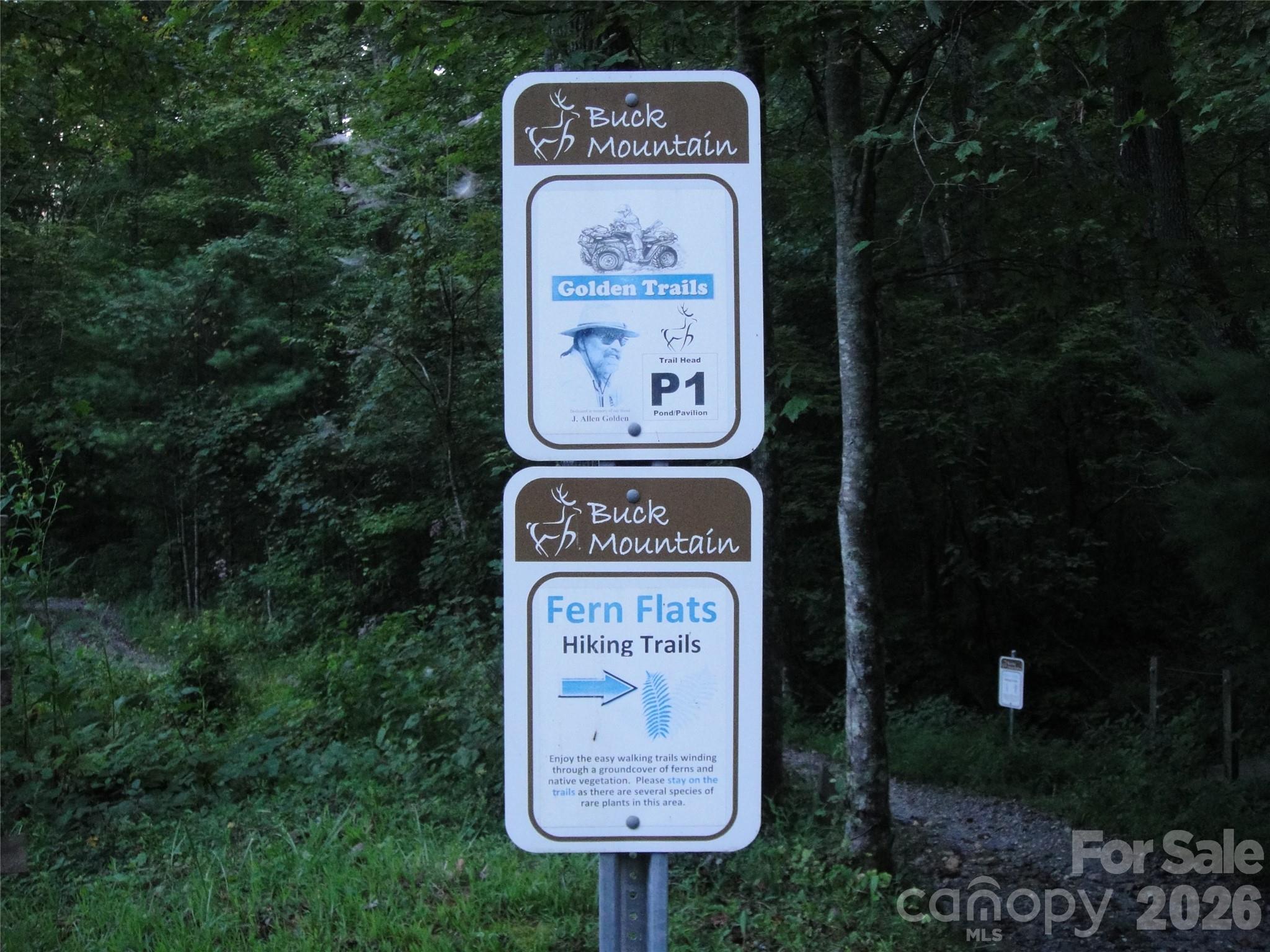 Tbd Buck Mountain Road, Unit 21 Purlear, NC 28665 - Photo 35 of 43 a sign on the side of the road