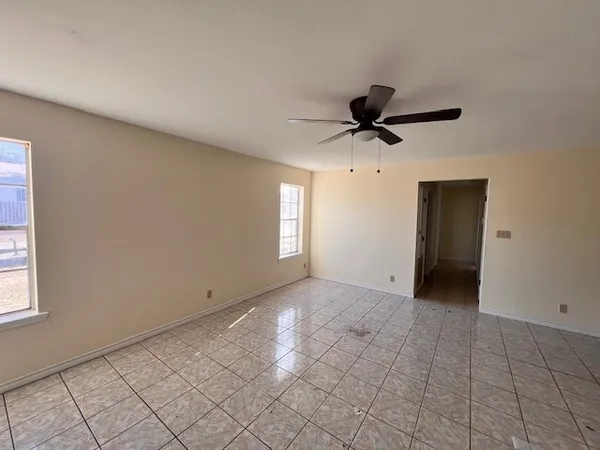 a view of an empty room and window