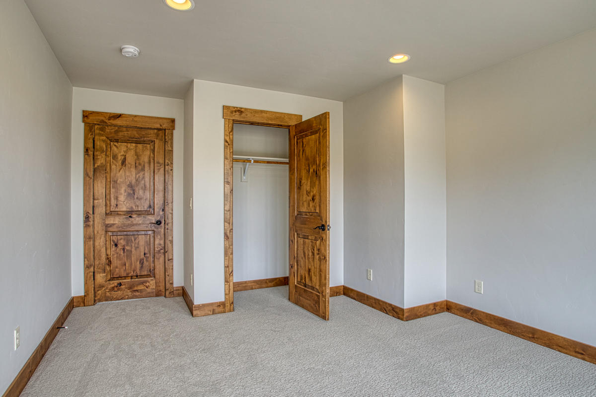 15751 South W Brasada Ranch Road, Unit LOT 363 Powell Butte, OR 97753 - Photo 39 of 47 an empty room with closet and a hallway