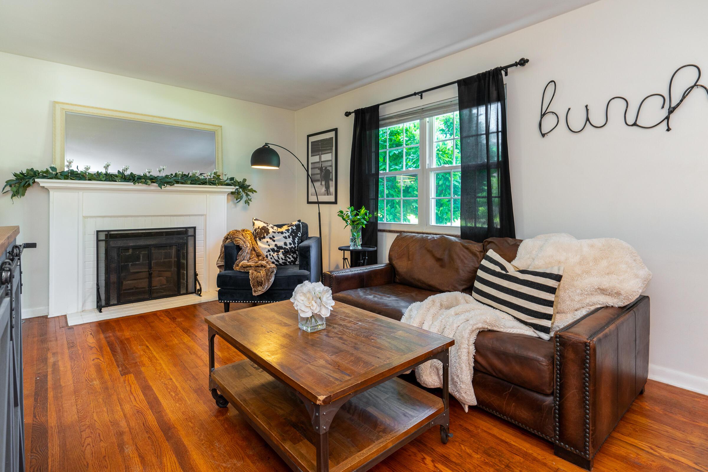 2272 Bristol Road Columbus, OH 43221 - Photo 9 of 38 Living room boasts decorative fireplace & gorgeous wood floors.