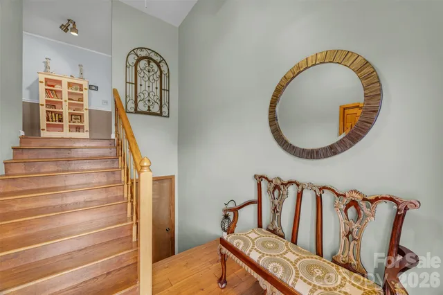 a swimming pool with outdoor seating and yard