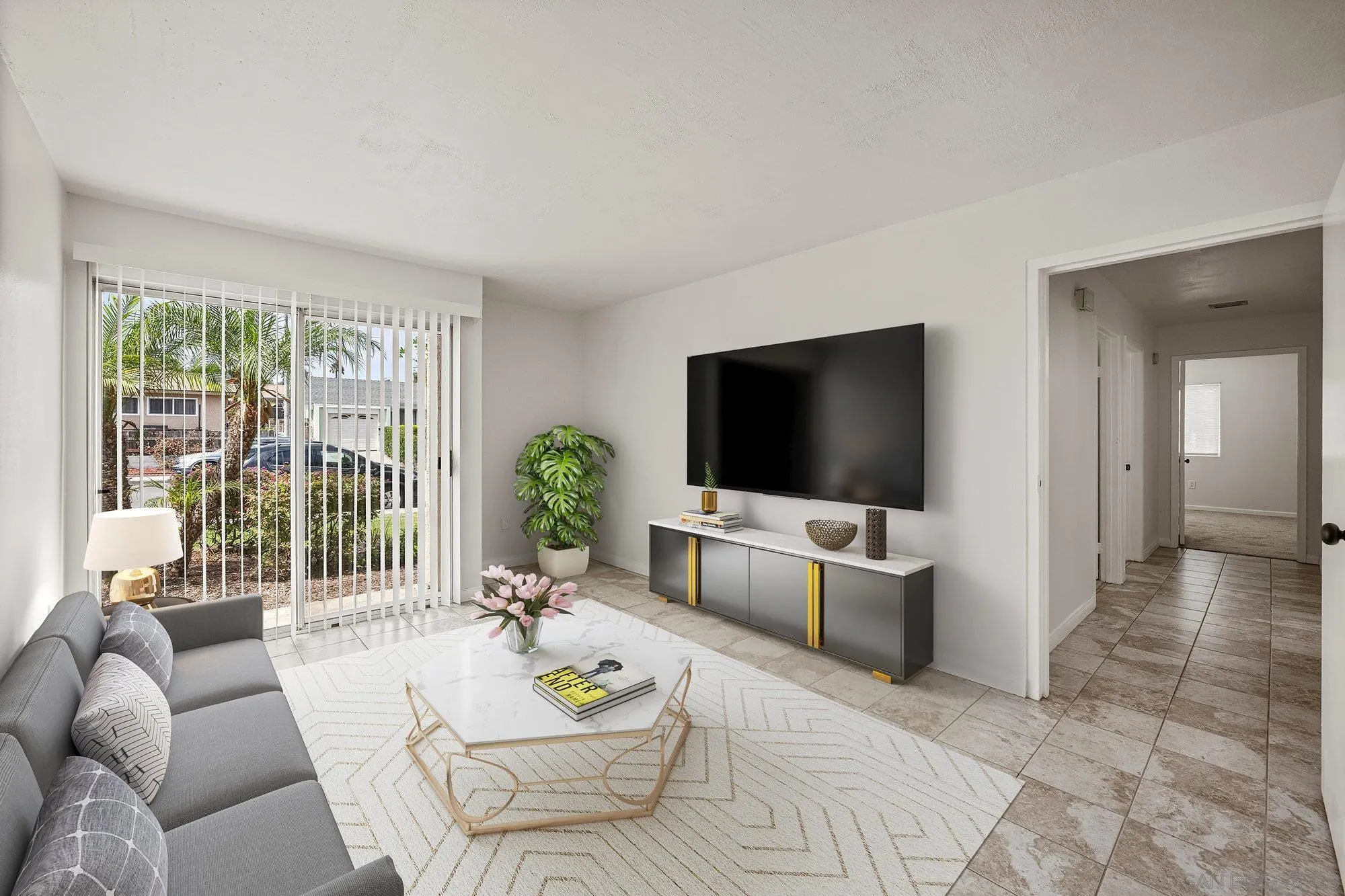 a living room with furniture and a flat screen tv