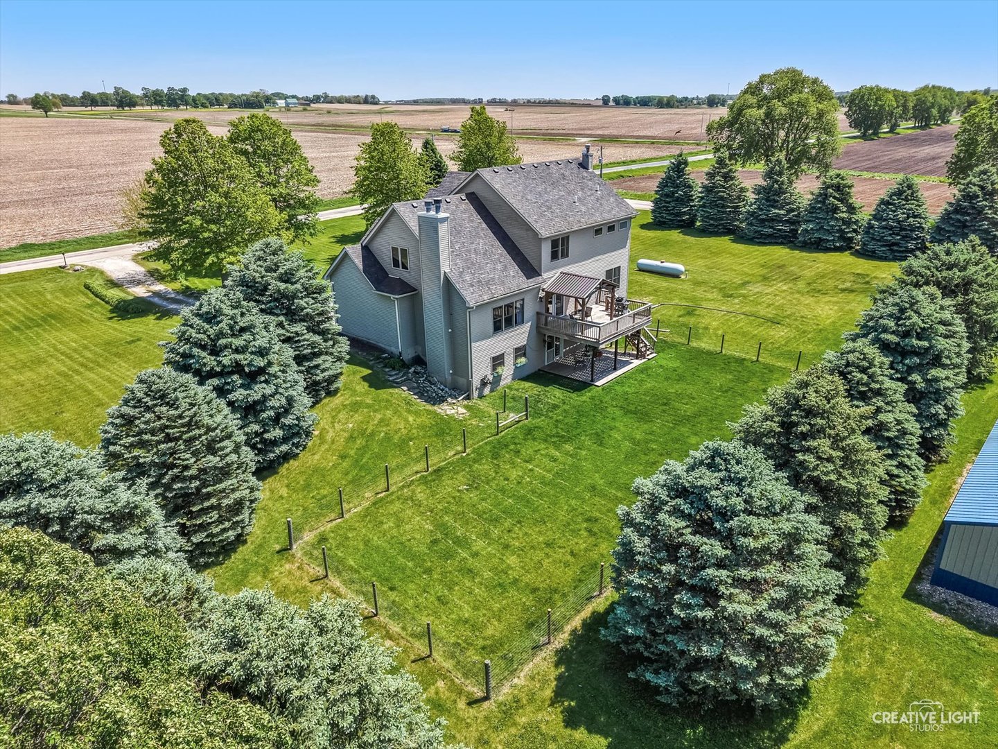 13495 Fennel Road Newark, IL 60541 - Photo 42 of 43 an aerial view of a house with a garden and lake view