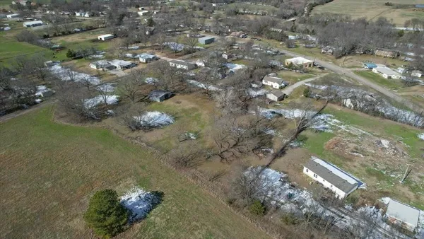 a aerial view of a house with a yard