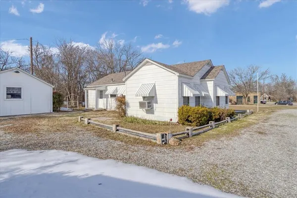 a house view with a backyard space
