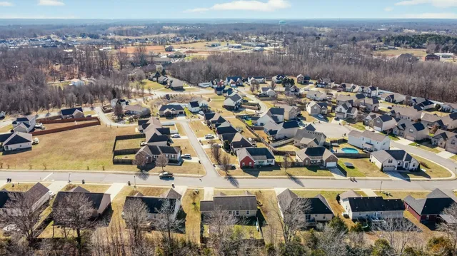 a view of a park with iron fence