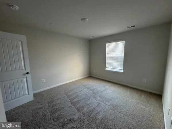 a kitchen with stainless steel appliances a refrigerator stove and microwave