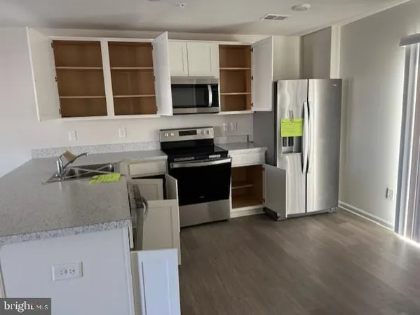a bathroom with a toilet sink and shower